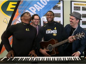 Eskimos defensive end Odell Willis, left, and  receiver Adarius Bowman, second from right, have a little fun behind a keyboard with Hey Romeo co-founders Rob Shapiro and Darren Gusnowsky, far right, at the press preview of Porkaplooza, a three-day festival to kick off the Eskimos' 2016 season.
