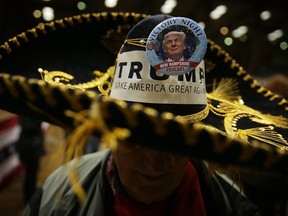 Jim Yates of Laurens, South Carolina, pins a Trump campaign button on his hat during a campaign rally of Republican presidential candidate Donald Trump on Feb. 10, 2016 in Clemson, S.C.