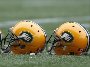 Helmets belonging to members of the Edmonton Eskimos sit on the field during a team practice in Winnipeg, Man. Wednesday, Nov.,25, 2015. The Eskimos will play the Ottawa Redblacks in the 103rd Grey Cup Sunday.