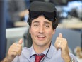 Prime Minister Justin Trudeau reacts after playing a virtual reality video game during a visit to video game maker Ubisoft Thursday.