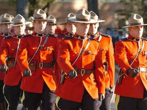 RCMP cadets from a variety of troops march during the sunset ceremony at RCMP Depot Division in Regina on July 18, 2006.