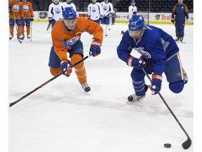 (left to right) Mark Fayne and Matt Hendricks take part in an Edmonton Oilers practice at Rexall Palce, in Edmonton Alta. on Wednesday Feb. 17, 2016. Photo by David Bloom