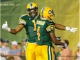 Shamawd Chambers, left, celebrates a touchdown with teammate Adarius Bowman during a game against the Ottawa Redblacks in July, 2014. Chambers signed with the Saskatchewan Roughriders on Tuesday.
