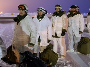 Paratroopers with the 3rd Canadian Division Princess Patricia Canadian Light Infantry (3 PPCLI) prepare to board a CC-150J Hercules aircraft en route to Resolute Bay, NU on Friday, February 12, 2016.