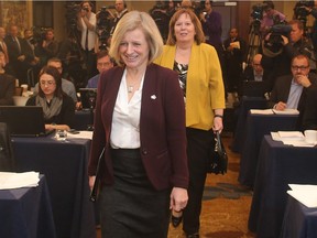 Premier Rachel Notley enters the news conference announcing the findings of the Alberta Royalty Review Advisory Panel in Calgary followed by Energy Minister Margaret McCuaig-Boyd on Friday January 29, 2016.