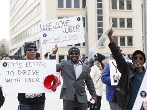 Uber supporters rally at the Alberta Legislature in Edmonton on Saturday February 27, 2016.