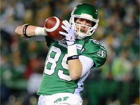 Saskatchewan Roughriders slotback Chris Getzlaf catches a pass as they face the Hamilton Tiger-Cats during second quarter of at the Grey Cup Sunday, November 24, 2013, in Regina.
