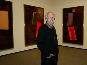 Douglas Haynes in 2005 in front of his The Toledo Series, a key change in style for the artist during his long career. File photo.