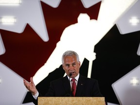 Tom Renney speaks at a news conference as the new head of Hockey Canada in Calgary, Alta., Tuesday, July 15, 2014.THE CANADIAN PRESS/Jeff McIntosh