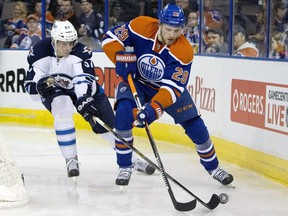 Winnipeg Jets defenceman Tyler Myers chases Edmonton Oilers forward Leon Draisaitl during second period NHL action in Edmonton on February 13, 2016.