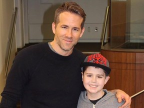 Canadian-born actor Ryan Reynolds with Edmonton's Connor McGrath.