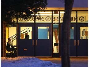 In this 2007 file photo, an RCMP officer monitors an entrance to Paul Kane High School in St. Albert.