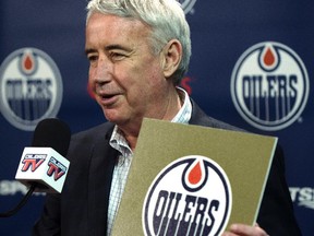 EDMONTON, ALTA: APRIL 20, 2015 -- Bob Nicholson, talking to the media about being appointed CEO of the Oilers Entertainment Group Monday, holds the gold card from the 2015 NHL Draft Lottery Draw, at Rexall Place in Edmonton, April 20, 2015. (ED KAISER/EDMONTON JOURNAL)