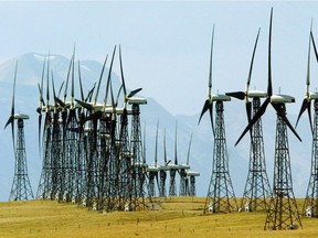 File: A line of turbines catch the breeze at the Canadian Hydro wind farm on Cowley Ridge east of Crowsnest Pass.