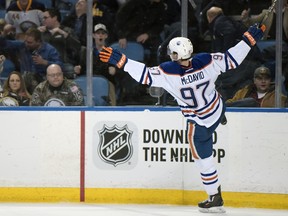 Edmonton Oilers center Connor McDavid celebrates his overtime goal against the Buffalo Sabres in an NHL hockey game Tuesday, March 1, 2016, in Buffalo, N.Y.  Edmonton won 2-1. (AP Photo/Gary Wiepert) ORG XMIT: NYGW108