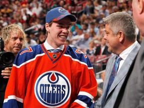 Edmonton won the 2015 NHL draft lottery with Connor McDavid, pictured talking to head coach Todd McClellan (R) after being selected first overall, but Edmontonians aren't nearly as lucky when it comes to improved employment insurance benefits, writes the C.D. Howe's Colin Busby.