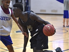 Aher Uguak, grade 12 student is one of 24 Canadian high schoolers playing in the Biosteel all-star game in Toronto on April 11, here practicing at Harry Ainlay School in Edmonton, March 9, 2016.