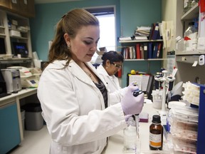 Brienne McKenzie (left), PhD student, and Manmeet Mamik, post-doctoral student, work in the Brain Power Lab at the University of Alberta in Edmonton on Thursday, March 10, 2016. Alberta Economic Development and Trade and Sanofi Genzyme Canada are contributing $500,000 each towards multiple sclerosis research through the Alberta Multiple Sclerosis Collaboration.