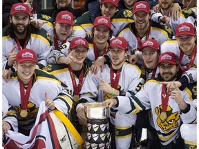 Alberta Golden Bears celebrate after defeating the UNB Varsity Reds 6-3 to win the Canadian Interuniversity Sports hockey championship in Halifax on Sunday, March 15, 2015.