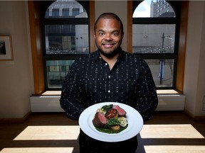 Celebrity chef Roger Mooking poses at the Telus Convention Centre in Calgary with the main dish, Alberta Love, that he will serve at the Juno gala dinner.