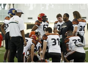 Edmonton Eskimos defensive backs/player development coach Barron Miles (second from right) speaks with players during the CFL Regional Combine held at Commonwealth Recreation Centre in Edmonton, Alta., on Monday March 7, 2016. Players who moved on will attend the national combine. Photo by Ian Kucerak