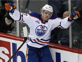 Edmonton Oilers Connor McDavid celebrates his tie-breaker goal against Minnesota Wild goalie Darcy Kuemper in the third period of an NHL hockey game Thursday, March 10, 2016, in St. Paul, Minn.