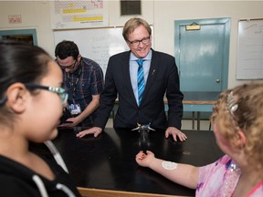 Education Minister David Eggen visits with students following his announcement about the approval of career programming for Alberta students in grades 5 through 9 .