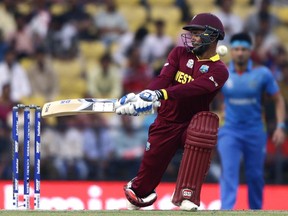 West Indies' batsman Denesh Ramdin is hit as he miscues a switch-hit during their ICC World Twenty20 2016 cricket match against Afghanistan in Nagpur, India, Sunday, March 27, 2016.