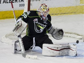 Edmonton Oil Kings goalie Payton Lee makes a save against the Calgary Hitmen during second period Western Hockey League action on January 9, 2016, in Edmonton.