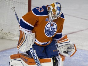 Edmonton Oilers Cam Talbot makes a save on the Vancouver Canucks during second period NHL action on March 18, 2016 in Edmonton.