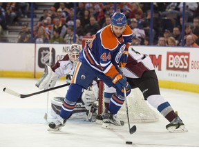 EDMONTON, AB. FEBRUARY 20, 2016 - Zack Kassian    of the Edmonton Oilers, tries to make a play in front of goal Calvin Pickard  of the Colorado Avalanche at Rexall Place in Edmonton.  Shaughn Butts / POSTMEDIA NEWS NETWORK