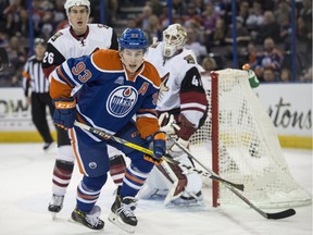 Ryan Nugent-Hopkins of the Edmonton Oilers chases a loose puck into the corner during NHL action against the Arizona Coyotes March 13, 2016, at Rexall Place in Edmonton. The Coyotes won 4-0.