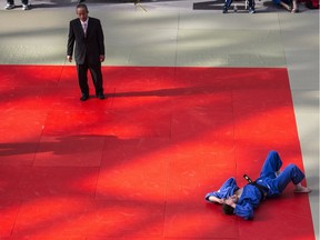 Jasmin Boisvert lies on the mat at the West Edmonton Mall's Mayfield Toyota Ice Palace after being defeated in the Edmonton International Judo championships men's black-belt 66 kg final by Matt Roots (not pictured). (Shaughn Butts)