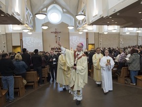 Archbishop, Richard Smith blesses the newly opened Corpus Christi Catholic on March 19, 2016.