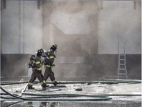 Firefighters worked for about two hours Sunday, March 20, 2016, to extinguish a fire at MTE Logistix in the north end. The fire was in the storage area of the building that housed cooking oils and lard.