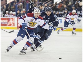 EDMONTON, AB. MARCH 7, 2016 - Davis Koch of the Edmonton Oil Kings, gets away from Libor Hajek of the Saskatoon Blades at Rexall Place in Edmonton.  Shaughn Butts / POSTMEDIA NEWS NETWORK