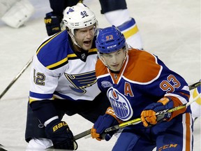EDMONTON, ALBERTA: MARCH 16, 2016 - St. Louis Blues David Backes (left) yells at Edmonton Oilers Ryan Nugent-Hopkins (right) during first period NHL hockey game action in Edmonton on March 16, 2016. (PHOTO BY LARRY WONG/POSTMEDIA NETWORK)