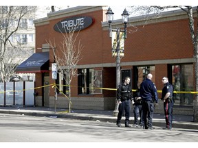 Edmonton police investigate last Sunday's shooting outside the Tribute Lounge near 81 Avenue and 105 Street in which Amin Mohammed Abdullahi was killed.