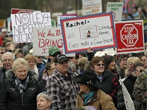 Hundreds of protestors rallied Tuesday at the Alberta legislature to protest farm legislation and a carbon tax.