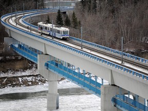 A train crosses the Dudley B. Menzies LRT Bridge in Edmonton.