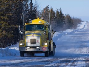 A fuel truck travels along the winter ice road from Fort McMurray to Fort Chipewyan in northern Alberta on February 4, 2015.
