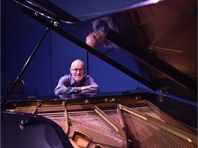 Joachim Segger is a music professor at King's University, pictured sitting at one of Glenn Gould's pianos.