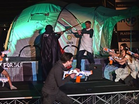 A Nerf gun fight breaks out Thursday at Strathcona High School during the opening ceremonies for the Bike2Box bike-a-thon in support of ShelterBox Canada .