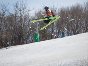 Ski and Snowboarders get some air while competing in the Slush Cup at the Edmonton Ski Club on March 19, 2016.