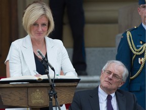 Top civil servant Richard Dicerni watches as Rachel Notley is sworn in as premier on the front steps of the Legislature, May 24, 2015.
