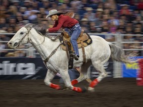 Julie Leggett competes in the ladies barrel race at the Canadian Finals Rodeo at Rexall Place in Edmonton on November 11, 2015.