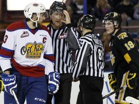 Edmonton's Brandon Baddock (left) and Brandon's Nolan Patrick exchange words during the second period of a WHL playoff game between the Edmonton Oil Kings and the Brandon Wheat Kings in Edmonton, Alta., on Wednesday March 30, 2016.