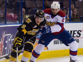 Brandon's Tanner Kaspick (16) battles Edmonton's Kyle Yewchuk (2) during playoff action at Rexall Place Edmonton, Alta on Thursday, March 31, 2016.