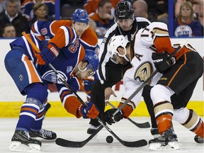 Edmonton's Leon Draisaitl (29) and Anaheim's Ryan Kesler (17) faceoff during the second period of an NHL game between the Edmonton Oilers and the Anaheim Ducks at Rexall Place in Edmonton, Alta., on Monday March 28, 2016.