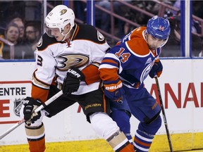 Edmonton's Jordan Eberle (14) battles Anaheim's Jakob Silfverberg (33) during the second period of an NHL game between the Edmonton Oilers and the Anaheim Ducks at Rexall Place in Edmonton, Alta., on Monday March 28, 2016.